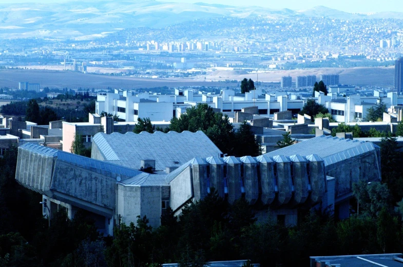 the city is surrounded by trees and some very tall buildings