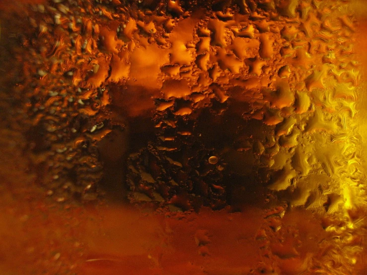 abstract pograph of water on an orange glass