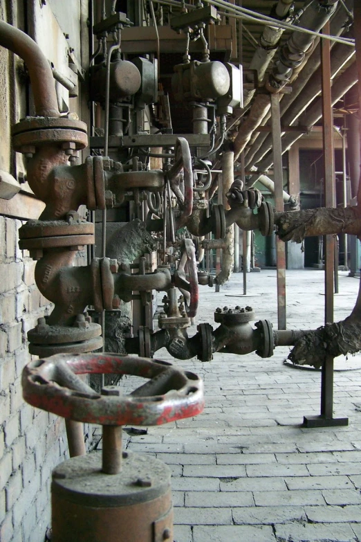various industrial pipes and valves in a building