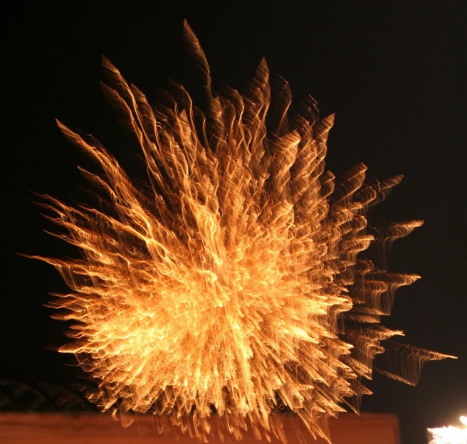 fireworks exploding in the dark night sky, with no people around