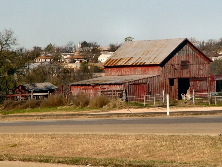 there is a very old barn with rusty tin roof