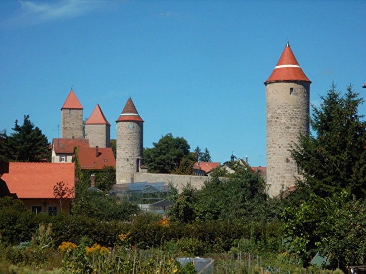 an image of a castle setting with a few towers