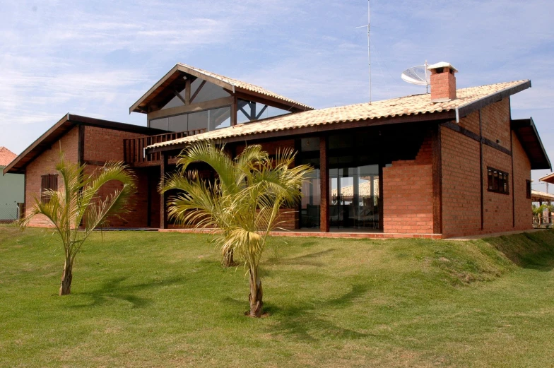 a house in the middle of some grass