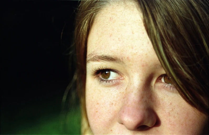 a closeup s of a young woman's eye