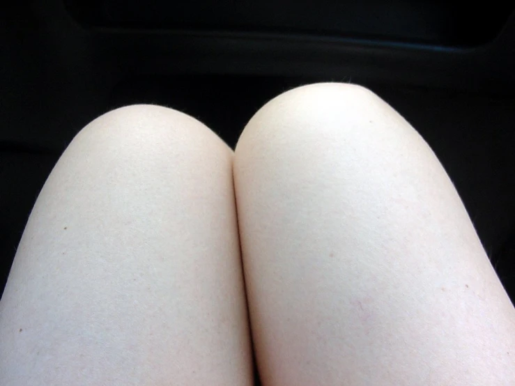 a girl's legs with soing white on them