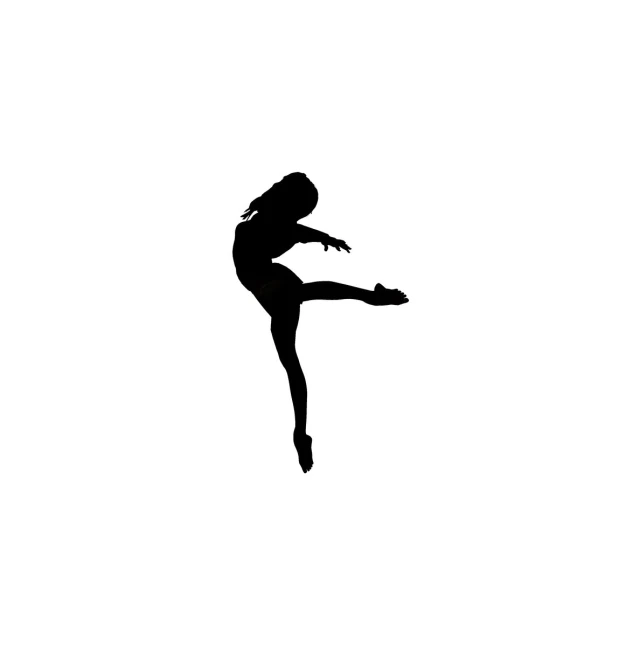 the dancer is jumping to the side in silhouette