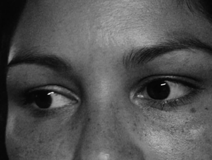 a close up of the eyes of a woman