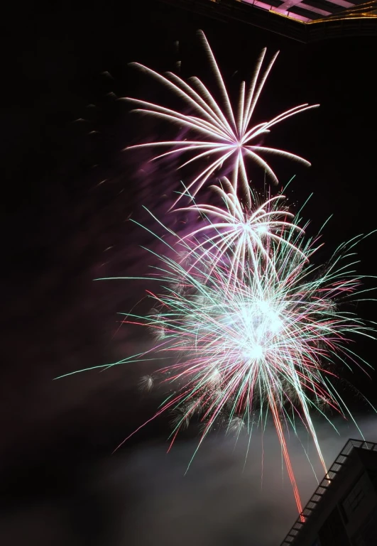 fireworks, lit from underneath and in the air