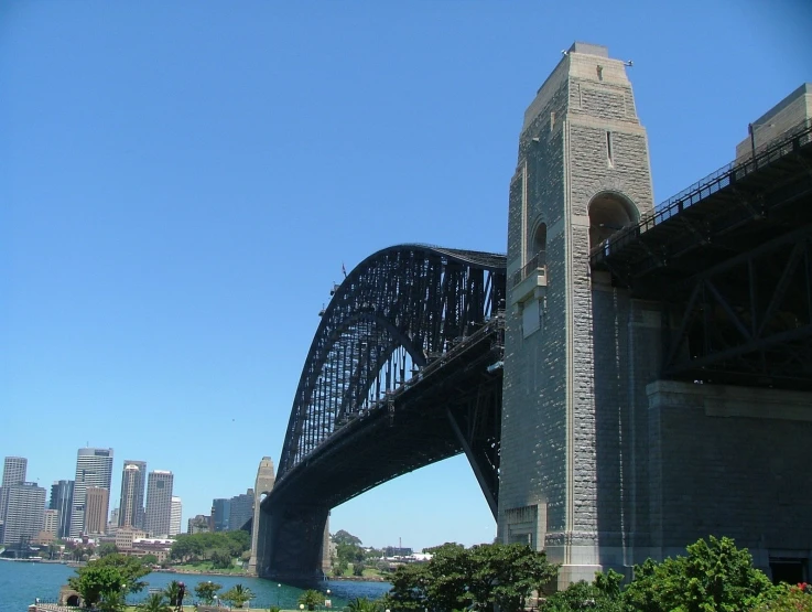 the view from a park in front of some bridges