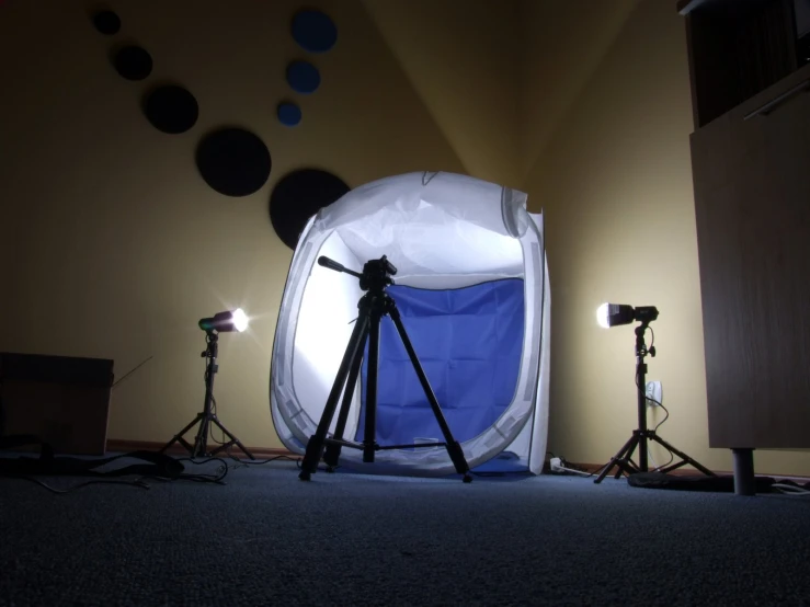 some lights are near a large white chair