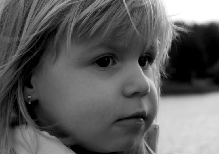 a close up of a child wearing a shirt