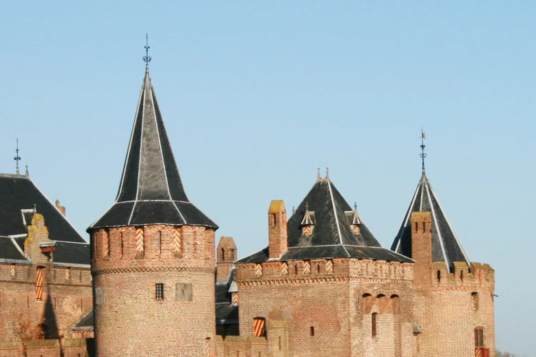 there is an old castle with a clock on top