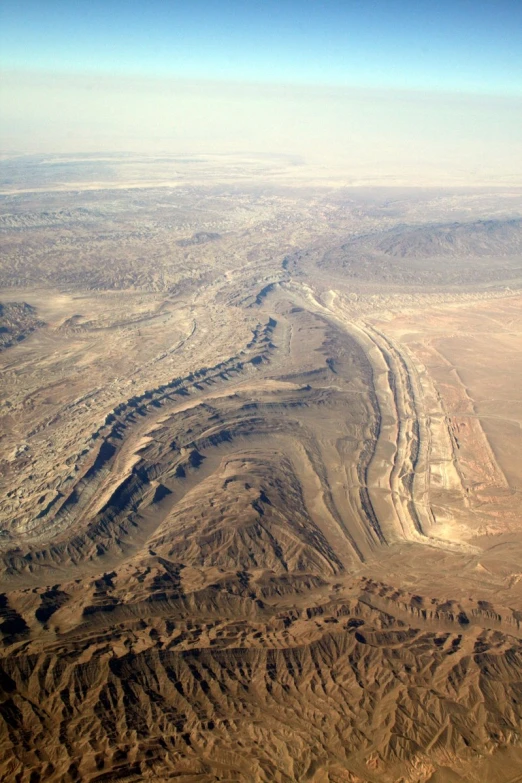 a wide valley surrounded by desert like areas