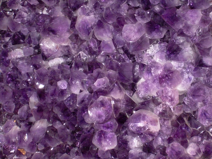 a purple stone filled with small chunks of crystals