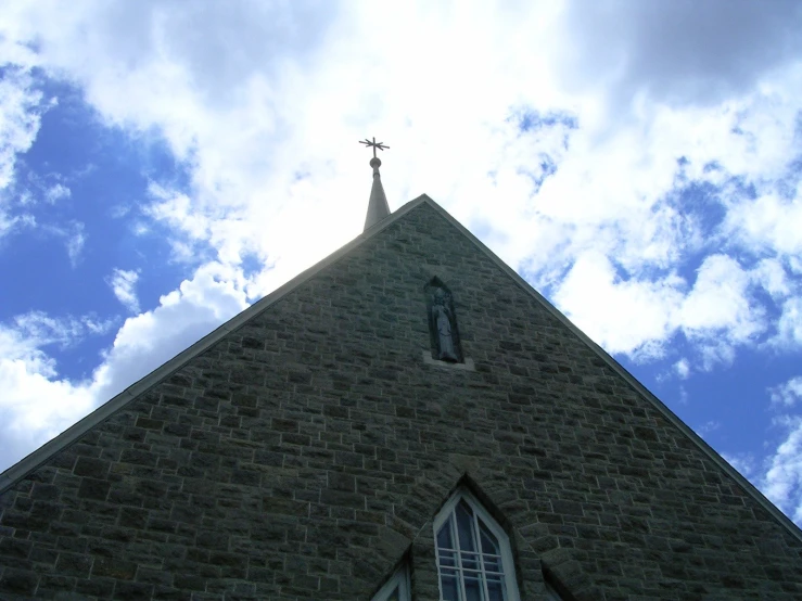 a building with a tall steeple covered in a crucifix