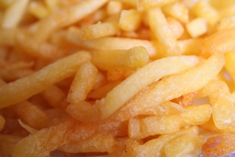 close up of the crumbs on a pile of fries