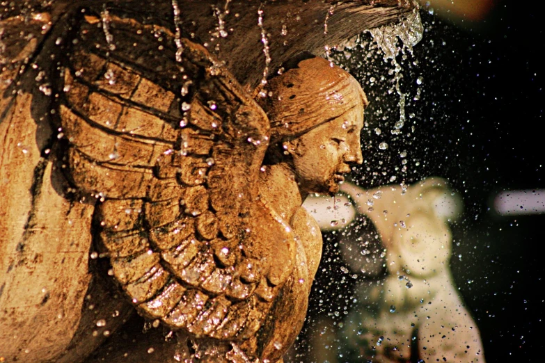 a wooden sculpture depicting an angel with wings on the body