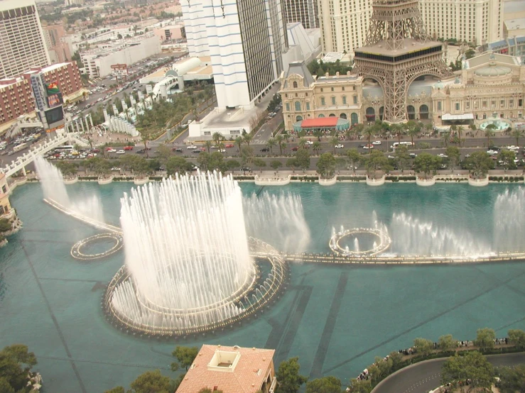 an aerial view shows the fountains in the water in the middle of the city