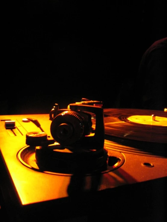 a turntable on a desk with a vinyl player on the side