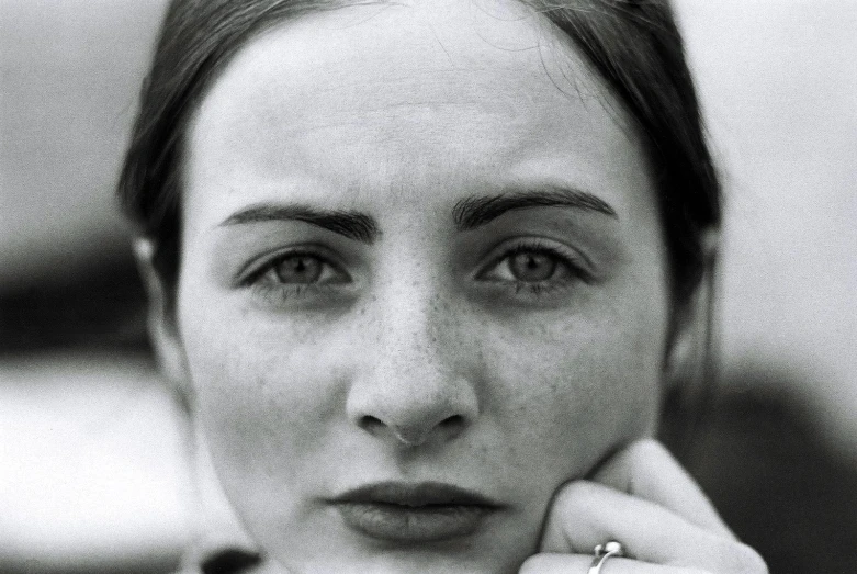 black and white pograph of a woman staring up