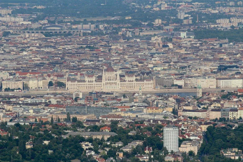 a city view that has buildings and trees in it