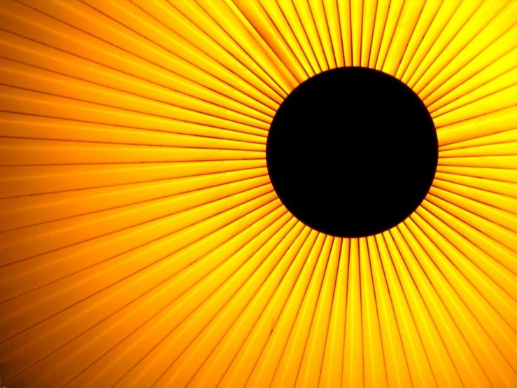 a black hole on top of yellow stripes