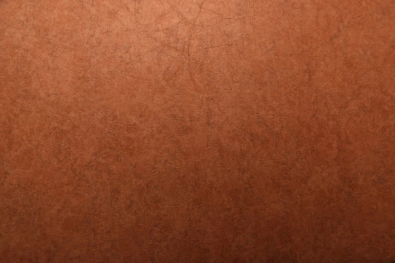 an orange sheet on brown background with no edges