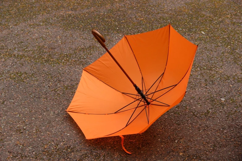 an orange umbrella is seen from up high