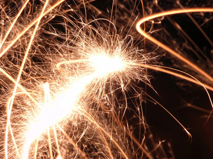 a firework display at night with bright orange