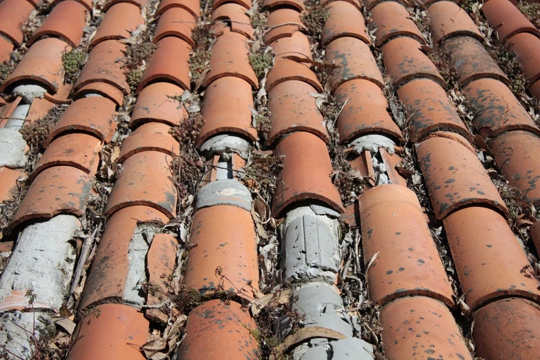 red tile roof with gutters in the middle