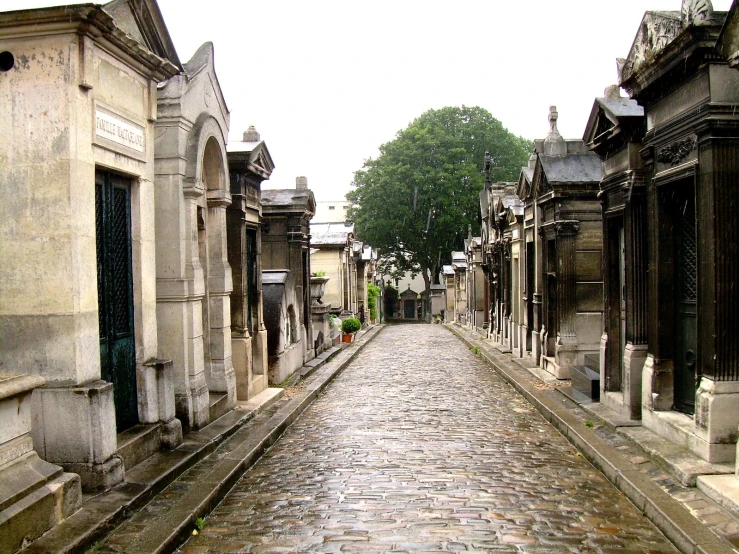 a brick street that is full of stone tombstones