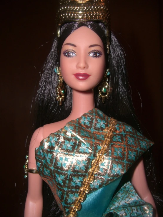 an egyptian barbie doll with dress and headpiece