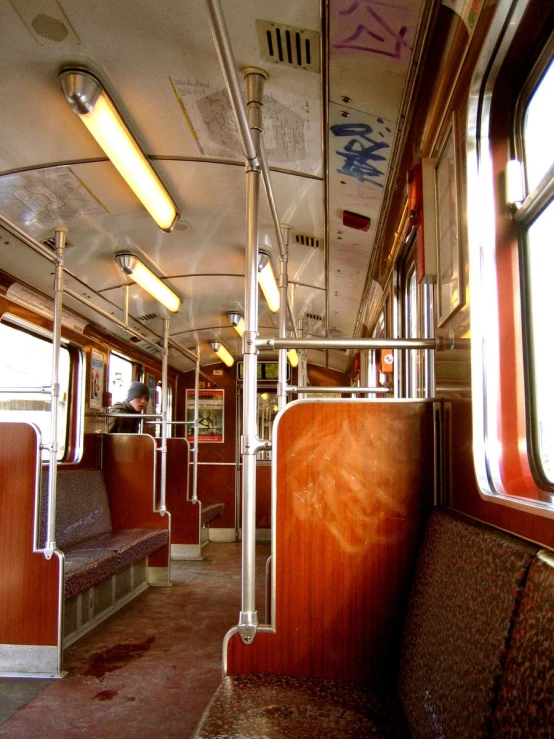 there is a empty bench on the subway car