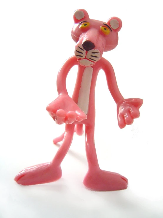 a pink figure with a black face and a brown nose