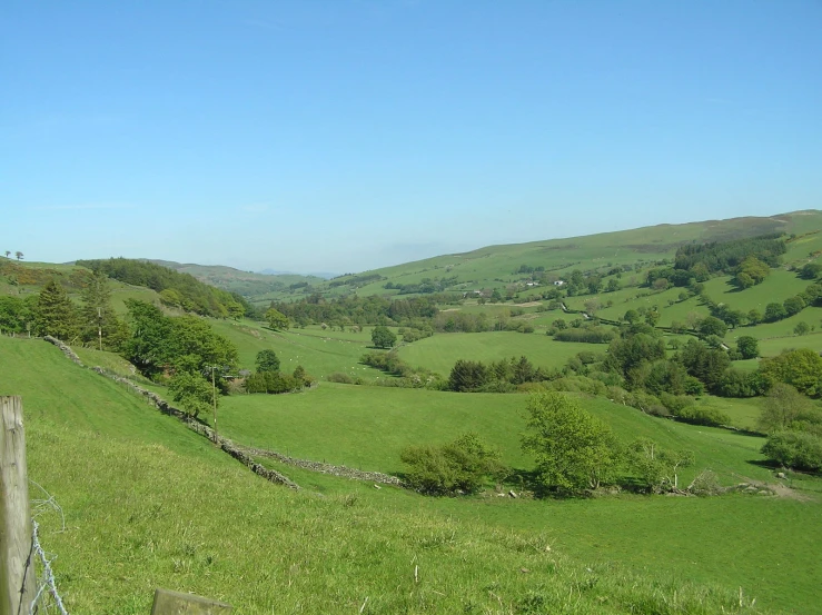 an image of a green hilly landscape