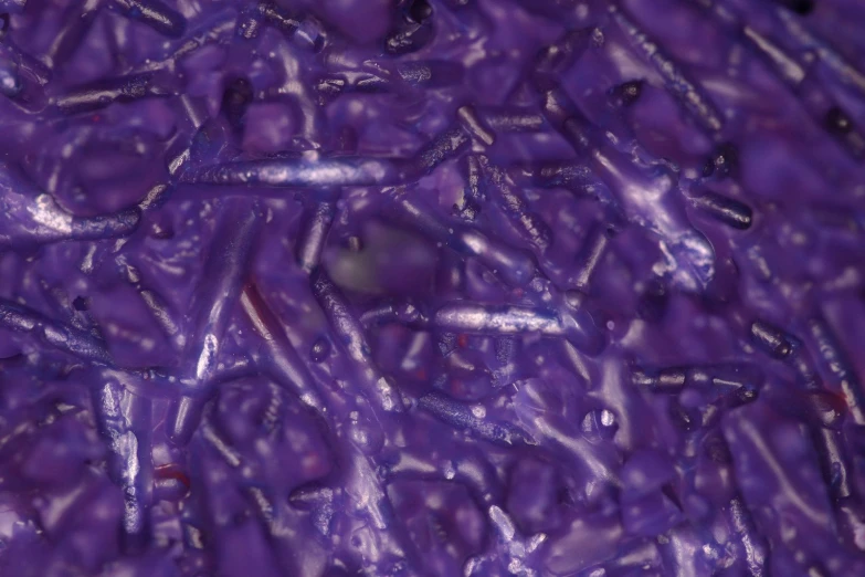 a picture of water droplets on purple material