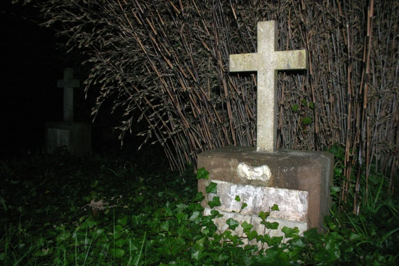 an old concrete cemetery with grass around it