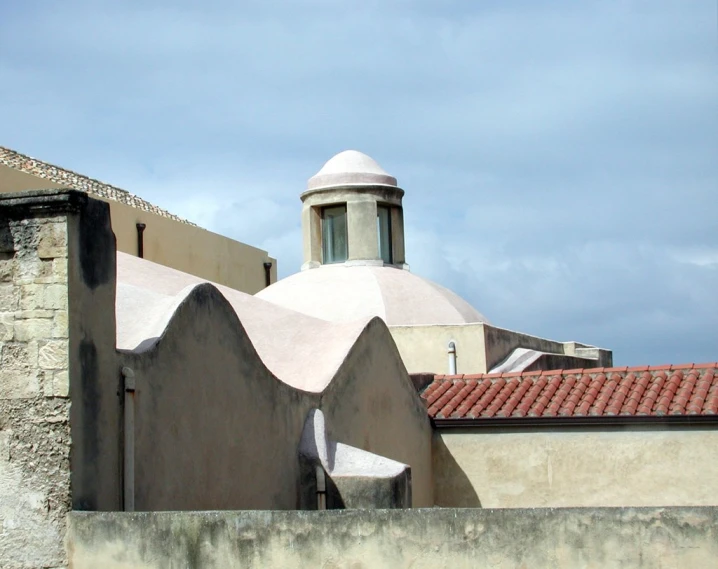 a clock tower seen from the top of the building