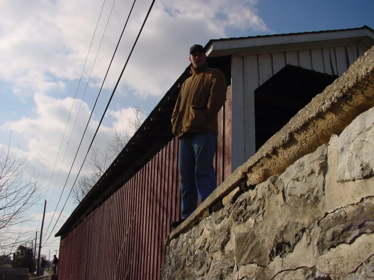 a man on top of a train in a building