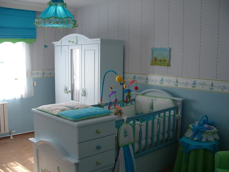 the room has blue and green colors, including striped wall paper, walls, curtains, furniture and rugs