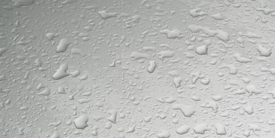 droplets are on the white surface and some dots are on the wall