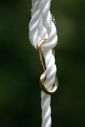 a close up of a rope hanging from the top