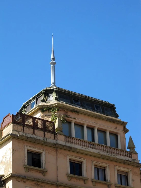 a steeple of a building with balconies and windows