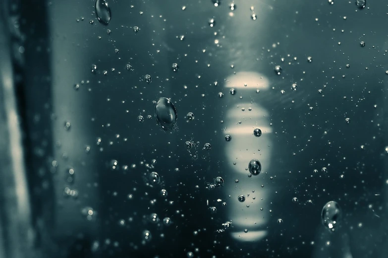 a very close up image of the surface with some drops of water