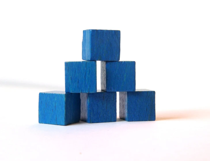 several blue blocks are stacked together on the floor