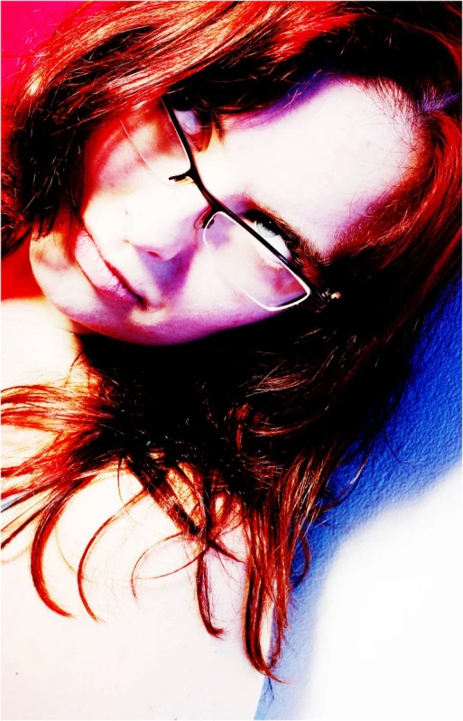 woman with glasses laying on top of her head