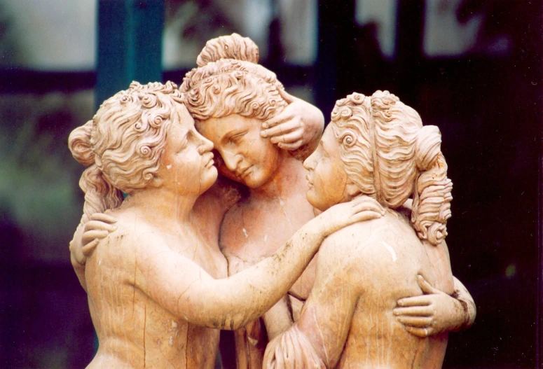 there are two figures, one hugging another