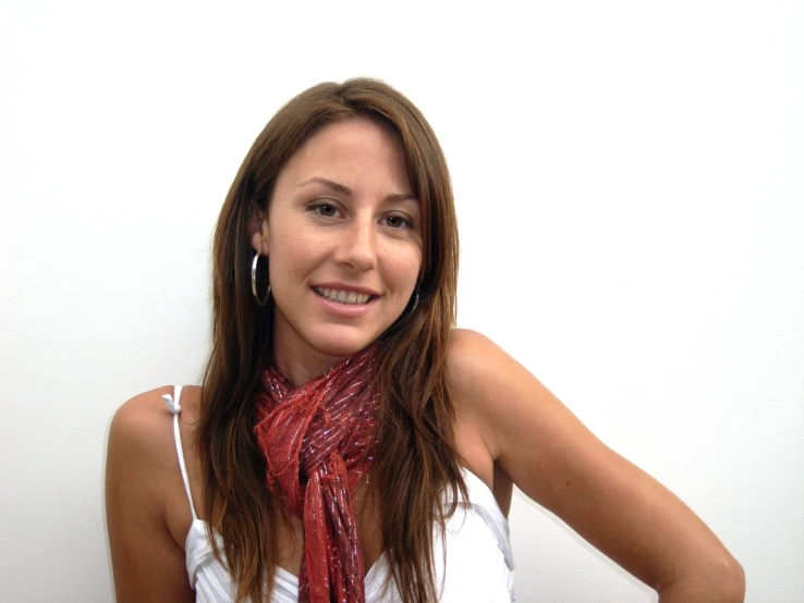 woman in white tank top wearing a red scarf