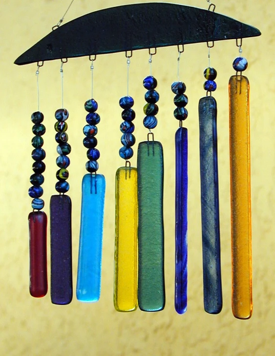 some hanging wind chimes made with multicolored beads