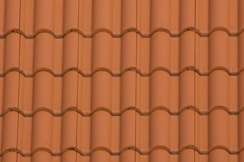 a row of orange roof tiles on top of each other